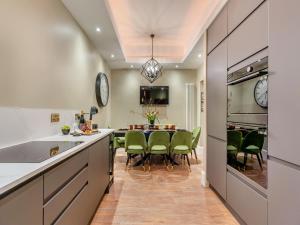 a kitchen and dining room with a table and chairs at Old Bank House in Barnard Castle +11 photos