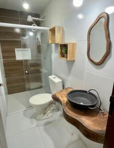 a bathroom with a sink and a toilet and a shower at Residencial Temporada Aracaju in Aracaju +127 photos
