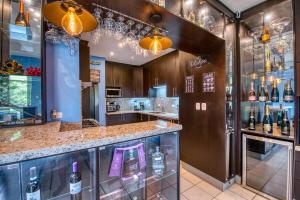 a wine shop with a bar with wine bottles at Hacienda Iguana Luxury Apartment with Pool & Golf in Tola +40 photos