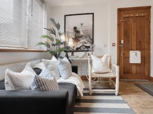 a living room with a couch and a table at The Rise in Scarborough