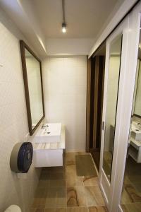 a bathroom with a sink and a mirror at 09 Hostel Chiangmai in Chiang Mai