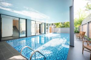 a swimming pool in the middle of a house at TS Villa in Danang