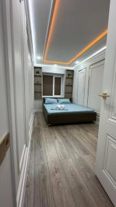a bedroom with a bed in a room at квартира in Taraz
