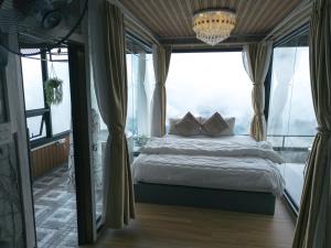 Postel nebo postele na pokoji v ubytování บ้านนุสรา รีสอร์ท ภูทับเบิก