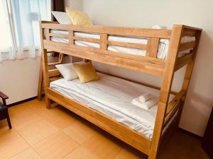 a couple of bunk beds in a room at Rest Collection SEIWA LODGE Tokyo in Tokyo