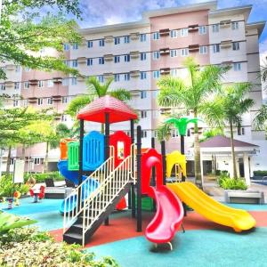 a playground at a hotel with a slide at THE IVORY STAYCATION suite at Hope Residences Trece Martires Cavite in Bitangan +28 photos