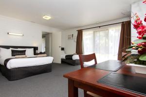 Postel nebo postele na pokoji v ubytování Frankston Motel
