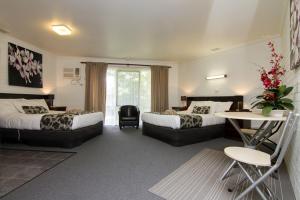 Postel nebo postele na pokoji v ubytování Frankston Motel
