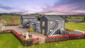 an aerial view of a house in a field at Tasman View Accommodation in Lower Moutere