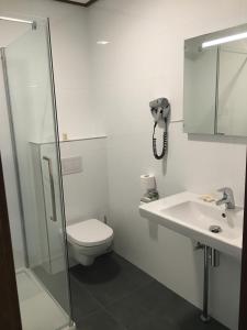 Koupelna v ubytování Hotel Faber