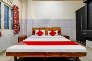 Ένα ή περισσότερα κρεβάτια σε δωμάτιο στο Hotel O Vishal Paradise