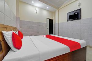 Ένα ή περισσότερα κρεβάτια σε δωμάτιο στο Hotel O Vishal Paradise