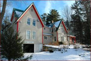 a large house with a red and white at Red Elephant Inn Bed and Breakfast in North Conway