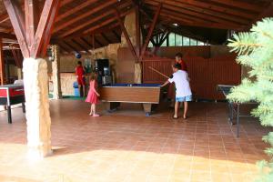 two children playing with a pool table in a room at Hotel Kristel Park - All Inclusive Light in Kranevo