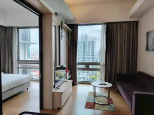 a hotel room with a bed and a tv and a couch at Swiss garden residence in Kuala Lumpur +142 photos
