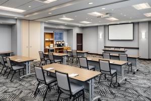 a classroom with tables and chairs and a projection screen at Hyatt Place Canton in Lake Cable +41 photos