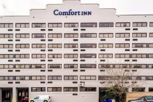 a white building with a sign on it at Comfort Inn Downtown Charleston in Charleston +19 photos