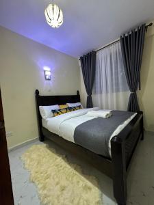 Postel nebo postele na pokoji v ubytování Gee homes kamakis