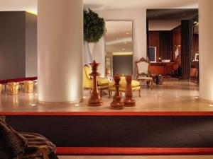 a lobby with chess pieces on a counter with a room at St Martins Lane London in London