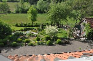 a view of a garden from the roof of a house at Forsthaus Wilmeröderberg in Polle