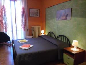 Llit o llits en una habitació de Soggiorno Petrarca