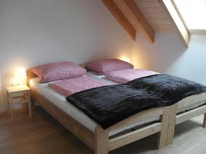 a bed with two pillows on it in a room at Ferienwohnung Elisabeth in Riedenburg