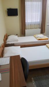 Postel nebo postele na pokoji v ubytování Hostel Kristal