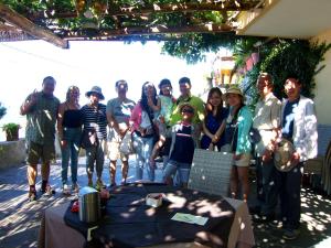 a group of people standing in front of a table at Locanda Degli Agrumi in Conca dei Marini