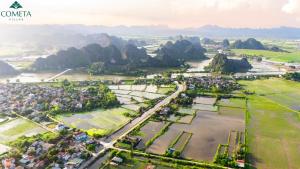 an aerial view of a park with mountains in the background at Cometa Villas Ninh Binh in Ninh Binh