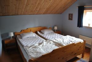 Кровать или кровати в номере Orsastuguthyrning - Stenberg