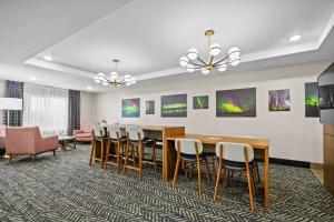 a conference room with a table and chairs at AmericInn by Wyndham International Falls in International Falls +79 photos