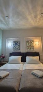 Postel nebo postele na pokoji v ubytování Mihail Residence - Relax in Kavala + 25 fotografií