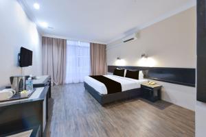 a hotel room with a bed and a sink at Sunday Malacca Formerly Tun Fatimah in Malacca +41 photos