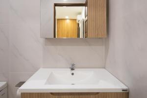 a bathroom with a white sink and a mirror at Luxury Tropical Villa Samui - Shira in Koh Samui  +12 photos