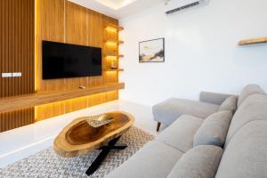a living room with a couch and a table at Luxury Tropical Villa Samui - Shira in Koh Samui 
