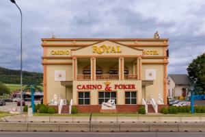 a casino and poker building on the side of a street at Casino & Hotel Royal in Česká Kubice