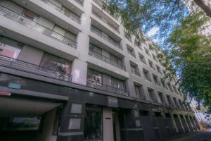 a white building with balconies on the side of it at Fengchia Love Heart in Taichung