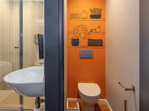 a bathroom with a toilet and a sink at ibis budget Lima Miraflores in Lima +35 photos