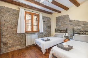 Ένα ή περισσότερα κρεβάτια σε δωμάτιο στο Casa Pirinea