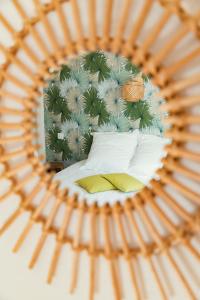 a reflection of a bedroom with a bed in a mirror at Domaine de la Papeterie in Glay