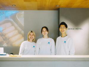 a group of three women standing in a room at SEKAI HOTEL Deep Osaka Experience in Osaka