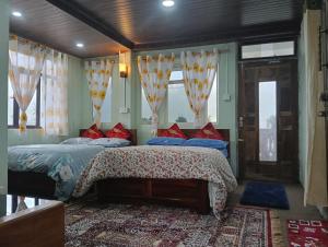 Ένα ή περισσότερα κρεβάτια σε δωμάτιο στο Grace Homestay