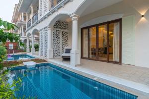 an image of a swimming pool in a house at Raina Villas Goa 6 bhk lux Pvt Pool in Arpora