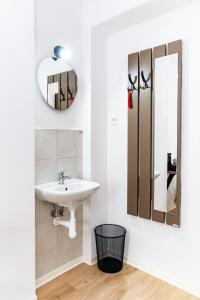 a bathroom with a sink and a mirror at Turistická ubytovňa pri Spojenom školskom internáte Werferova 10 in Košice