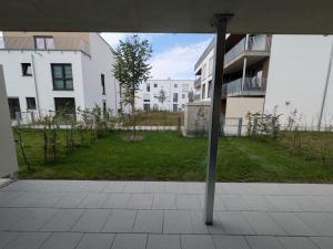 a view from an open window of a building at Ferienwohnung mit Garten, Terrasse, Tiefgarage in Zirndorf +3 photos