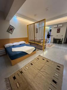 a bedroom with a bed with a cage in it at Omars shalet in Dahab