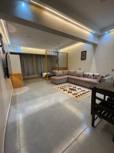 a living room with a couch and a table at Omars shalet in Dahab