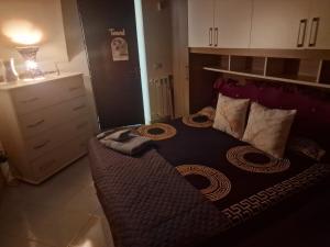 a small bedroom with a bed in a room at Casa vacanze MARIA AMATO in Marsala