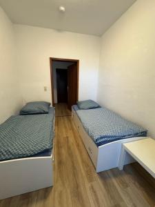 Postel nebo postele na pokoji v ubytování Nordstraße