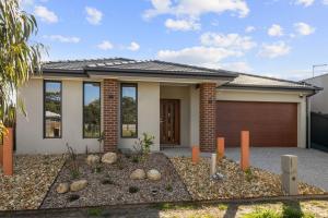 a rendering of a house with a garage at The Island Nirvana in Wimbledon Heights